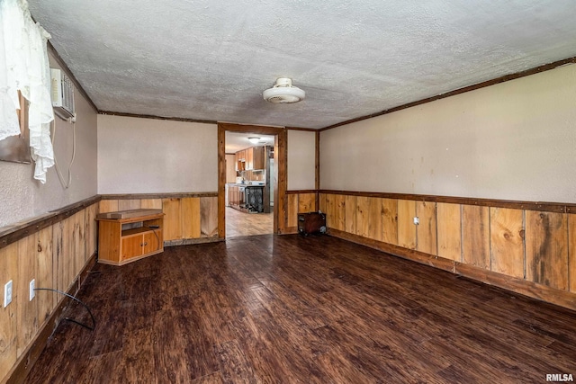 1904 E D St, West Frankfort, IL 62896 - unfurnished room with wood finished floors, a textured ceiling, wainscoting, wood walls, and crown molding