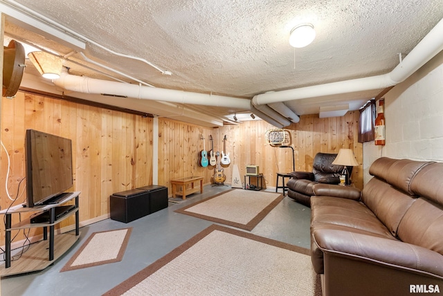 517 E 29th Pl, Davenport, IA 52803 - living area with finished concrete flooring, wooden walls, and a textured ceiling