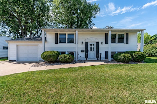 4718 19th Ave, Moline, IL 61265 - split foyer home featuring an attached garage, a front lawn, and concrete driveway