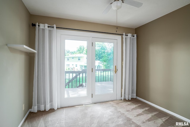 4718 19th Ave, Moline, IL 61265 - doorway featuring plenty of natural light, carpet, and ceiling fan