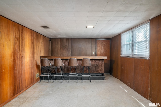 4718 19th Ave, Moline, IL 61265 - indoor dry bar with wooden walls and tile patterned floors