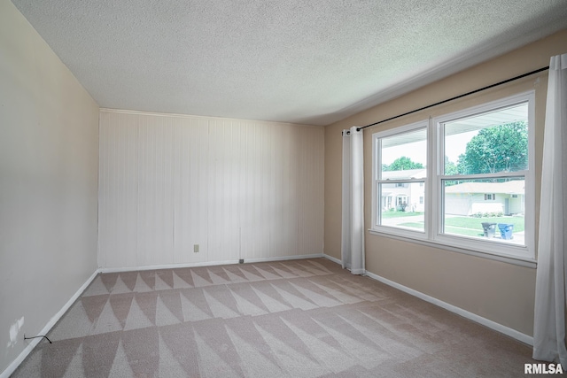 4718 19th Ave, Moline, IL 61265 - unfurnished room featuring a textured ceiling and carpet flooring