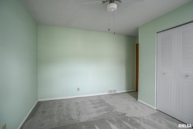 4718 19th Ave, Moline, IL 61265 - unfurnished bedroom featuring carpet floors, a closet, and a ceiling fan