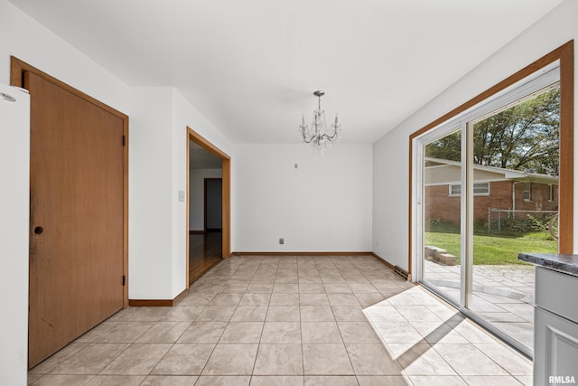 2525 4th St Unit A, East Moline, IL 61244 - unfurnished dining area with a chandelier and light tile patterned floors