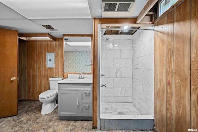 2525 4th St Unit A, East Moline, IL 61244 - full bath with vanity, a shower stall, wood walls, and stone finish floors