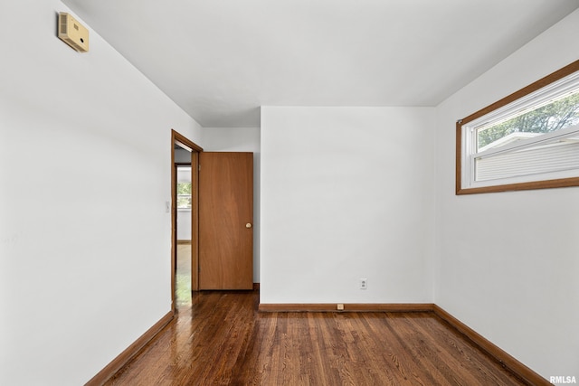 2525 4th St Unit A, East Moline, IL 61244 - spare room with dark wood-style floors and baseboards
