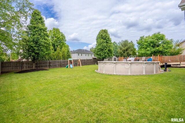 3484 Field Sike Dr, Bettendorf, IA 52722 - fenced backyard featuring a playground