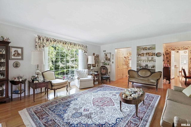 1928 Fernwood Ave, Davenport, IA 52803 - living area featuring crown molding, wood finished floors, and built in shelves