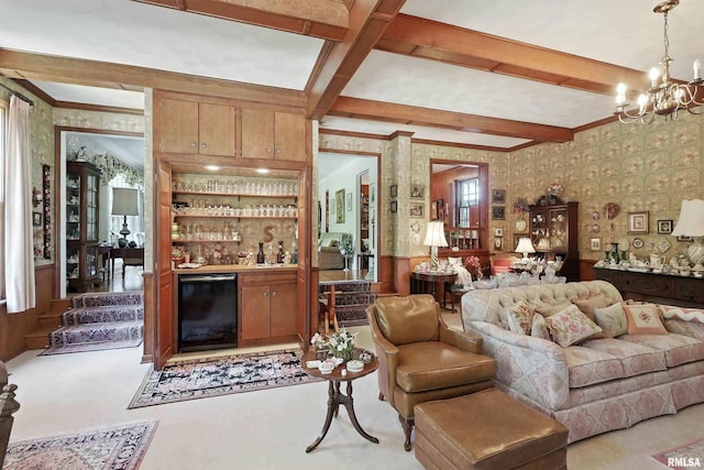 1928 Fernwood Ave, Davenport, IA 52803 - living room with wallpapered walls, crown molding, a chandelier, beamed ceiling, and light carpet