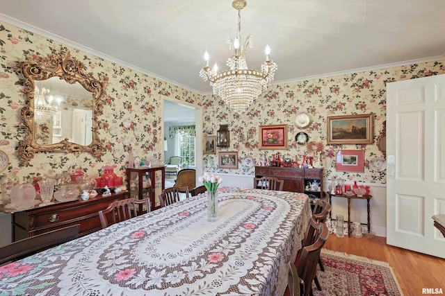1928 Fernwood Ave, Davenport, IA 52803 - dining area with crown molding, a chandelier, wood finished floors, and wallpapered walls