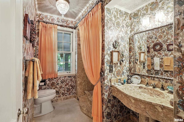 1928 Fernwood Ave, Davenport, IA 52803 - bathroom with wallpapered walls and ornamental molding