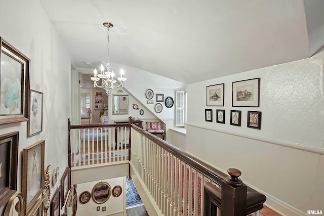 1928 Fernwood Ave, Davenport, IA 52803 - staircase with a chandelier and healthy amount of natural light