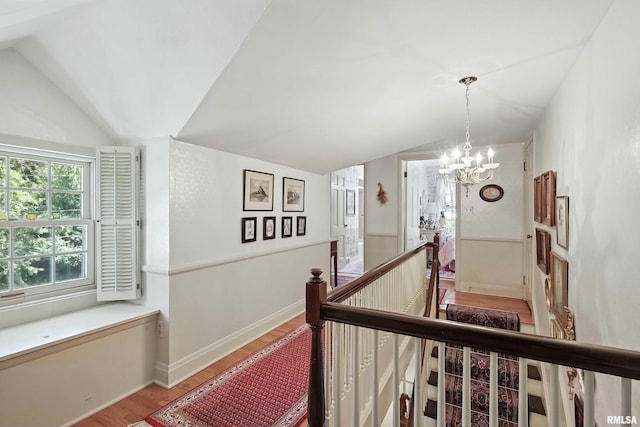 1928 Fernwood Ave, Davenport, IA 52803 - stairs featuring vaulted ceiling, wood finished floors, and a chandelier