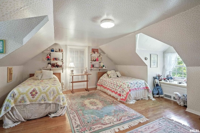 1928 Fernwood Ave, Davenport, IA 52803 - bedroom featuring lofted ceiling and wood finished floors