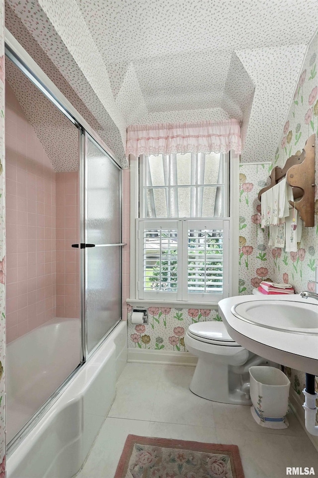 1928 Fernwood Ave, Davenport, IA 52803 - bathroom with wallpapered walls, combined bath / shower with glass door, and tile patterned flooring