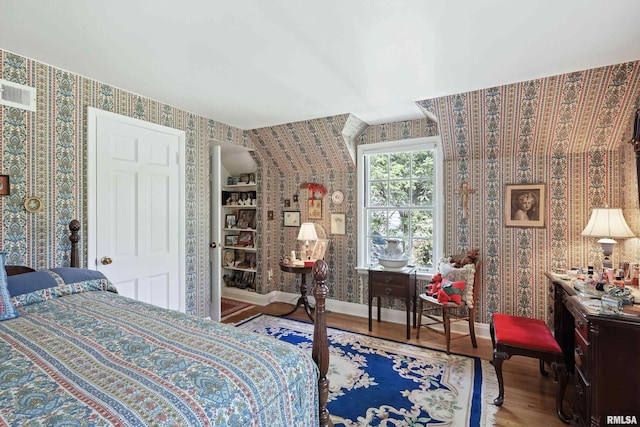 1928 Fernwood Ave, Davenport, IA 52803 - bedroom with wallpapered walls and wood finished floors