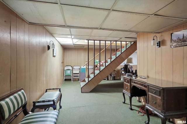 1928 Fernwood Ave, Davenport, IA 52803 - below grade area with stairway, carpet floors, a drop ceiling, and wood walls
