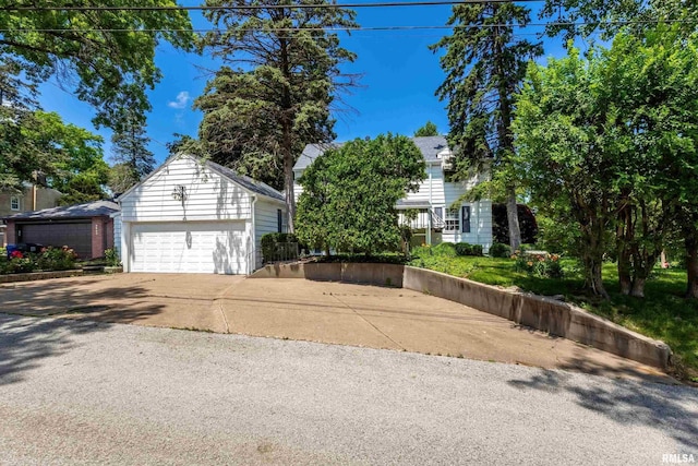 1928 Fernwood Ave, Davenport, IA 52803 - view of side of property featuring concrete driveway and an attached garage