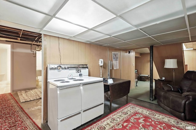 1928 Fernwood Ave, Davenport, IA 52803 - kitchen with white electric range, wood walls, and a drop ceiling