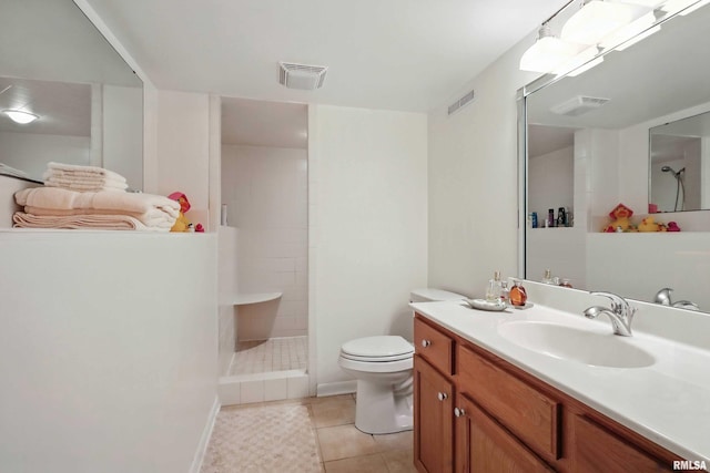 1928 Fernwood Ave, Davenport, IA 52803 - bathroom featuring a tile shower, vanity, and tile patterned flooring