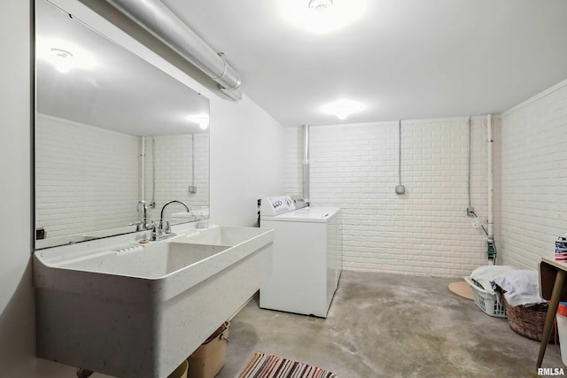 1928 Fernwood Ave, Davenport, IA 52803 - washroom with separate washer and dryer and brick wall