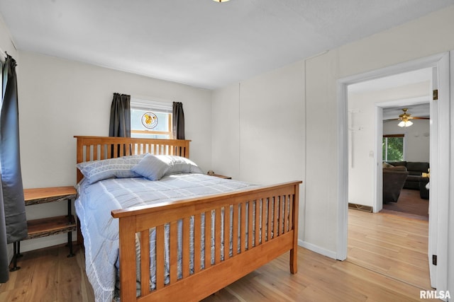 304 E Plum St, Anamosa, IA 52205 - bedroom with multiple windows and light wood-type flooring