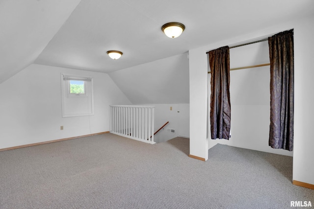 304 E Plum St, Anamosa, IA 52205 - bonus room featuring carpet floors and lofted ceiling