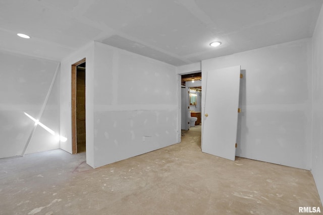 304 E Plum St, Anamosa, IA 52205 - unfurnished bedroom featuring concrete flooring