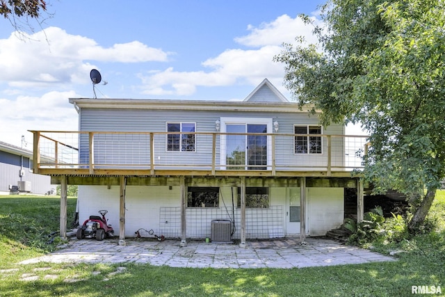 304 E Plum St, Anamosa, IA 52205 - rear view of house with a patio area, a wooden deck, and a yard
