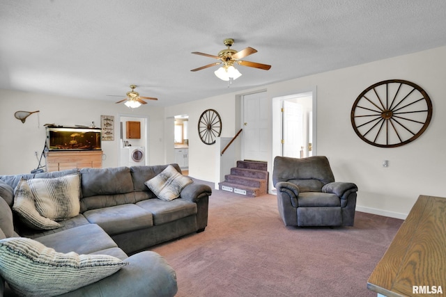 304 E Plum St, Anamosa, IA 52205 - carpeted living room with ceiling fan, washer / clothes dryer, stairway, and a textured ceiling
