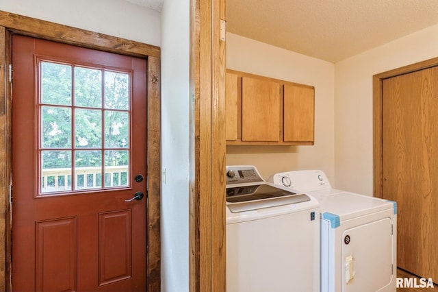 335 Sand Aly, Toronto, IA 52777 - laundry room with cabinet space, plenty of natural light, and independent washer and dryer