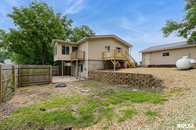 335 Sand Aly, Toronto, IA 52777 - rear view of house with a wooden deck