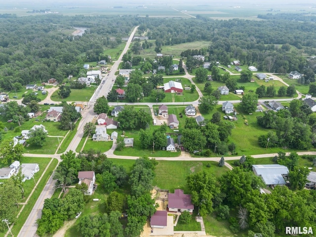 335 Sand Aly, Toronto, IA 52777 - aerial perspective of suburban area with a heavily wooded area