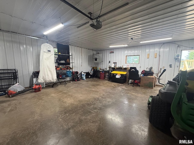 335 Sand Aly, Toronto, IA 52777 - garage featuring a garage door opener