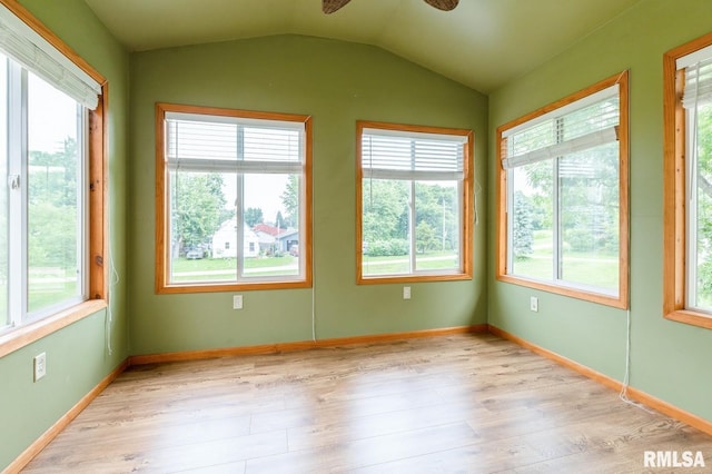 335 Sand Aly, Toronto, IA 52777 - unfurnished sunroom with healthy amount of natural light, wood finished floors, and vaulted ceiling