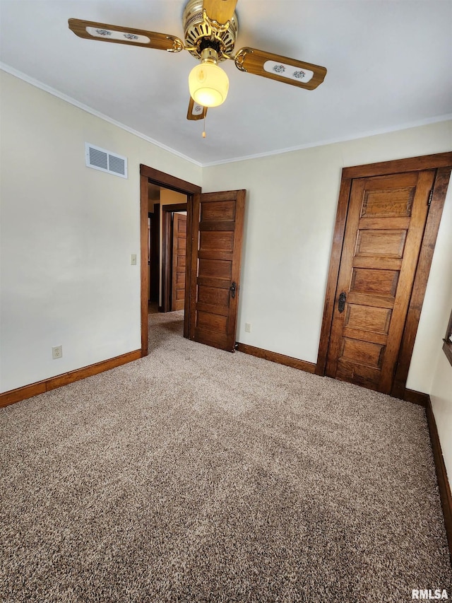 1908 24th St, Moline, IL 61265 - unfurnished room featuring carpet floors, crown molding, and a ceiling fan