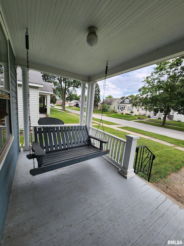 1908 24th St, Moline, IL 61265 - wooden porch with a residential view and a yard