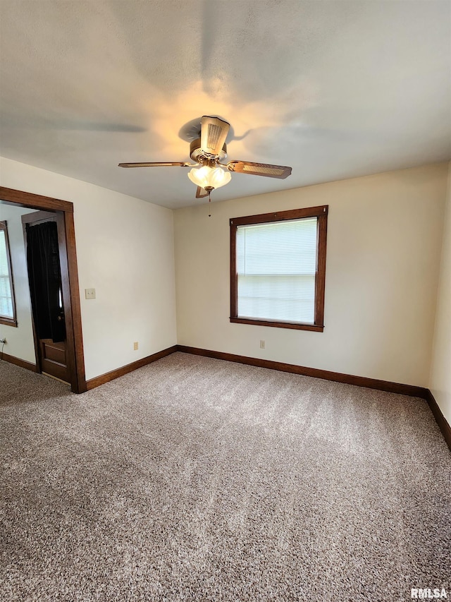 1908 24th St, Moline, IL 61265 - spare room with plenty of natural light, carpet, and ceiling fan