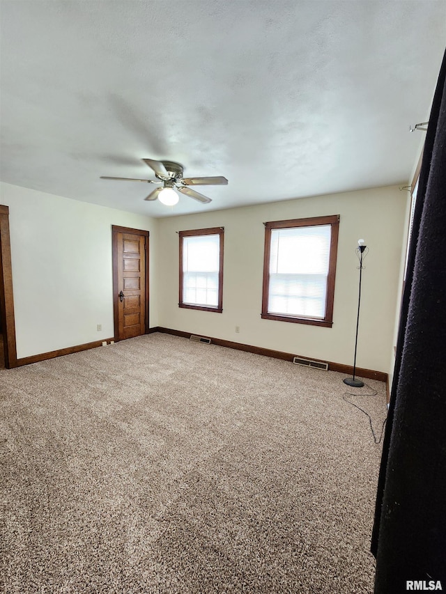 1908 24th St, Moline, IL 61265 - unfurnished room featuring carpet floors and ceiling fan