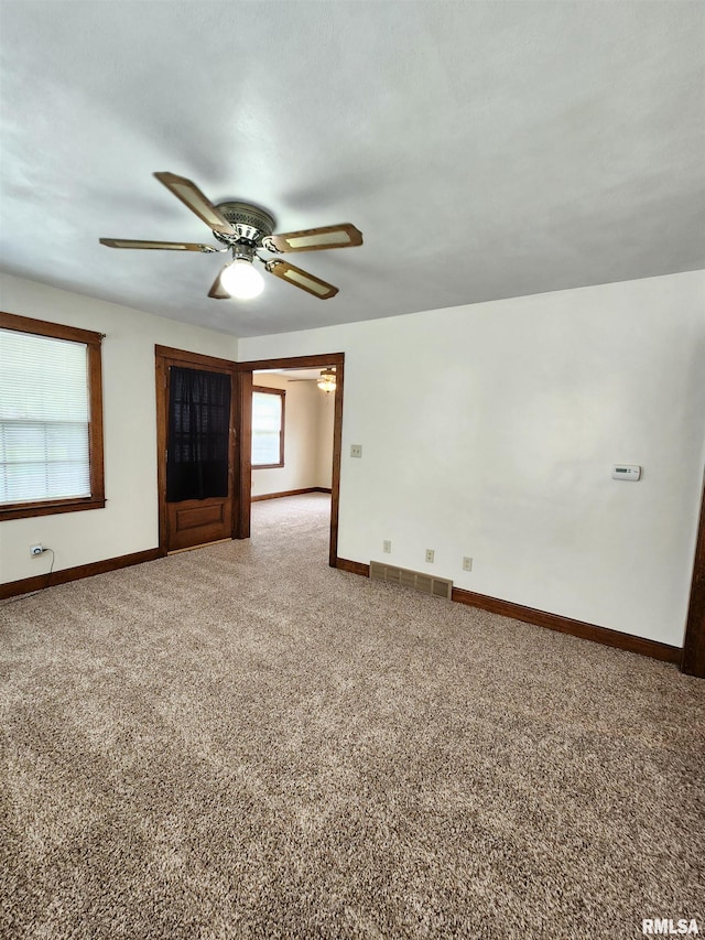 1908 24th St, Moline, IL 61265 - unfurnished living room with carpet flooring and ceiling fan