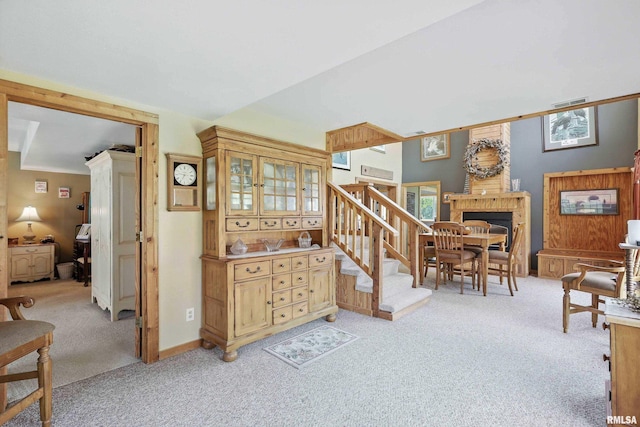 18599 317th St, Long Grove, IA 52756 - stairs featuring carpet flooring and a fireplace