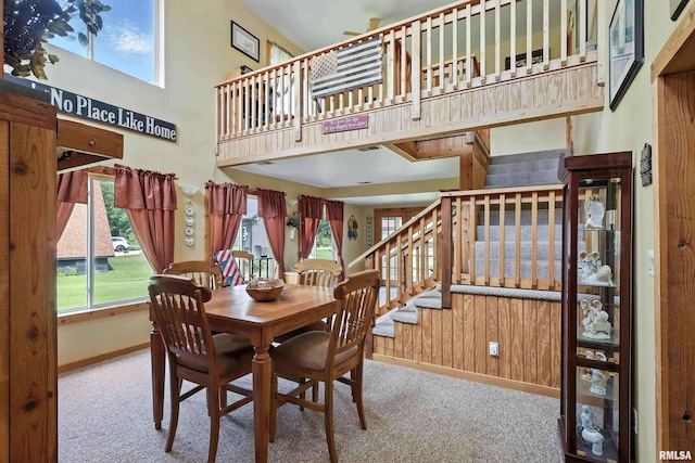 18599 317th St, Long Grove, IA 52756 - carpeted dining space with stairway and a high ceiling