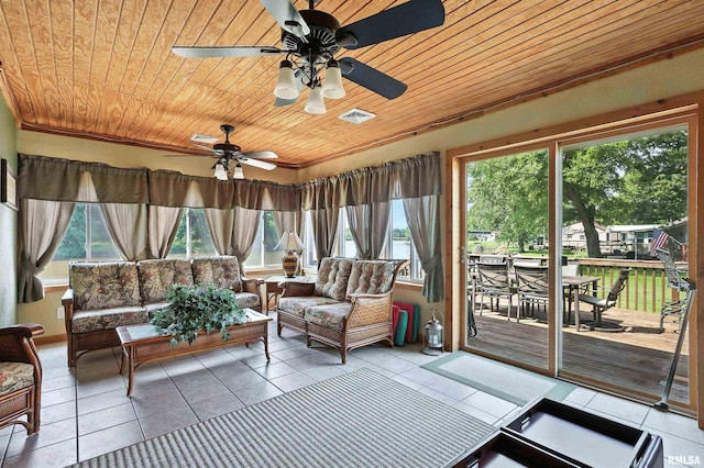 18599 317th St, Long Grove, IA 52756 - sunroom featuring outdoor dining area, a ceiling fan, and outdoor lounge area