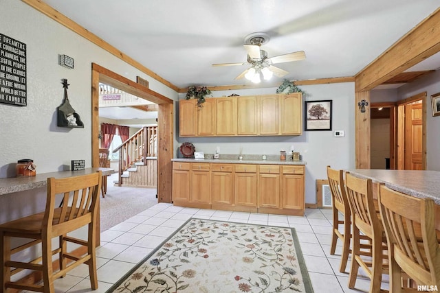 18599 317th St, Long Grove, IA 52756 - kitchen featuring ceiling fan, light tile patterned flooring, and light countertops