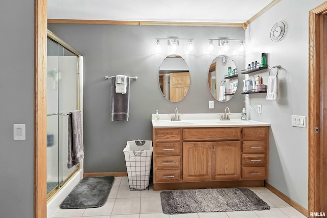 18599 317th St, Long Grove, IA 52756 - bathroom with double vanity, tile patterned floors, a shower stall, and crown molding