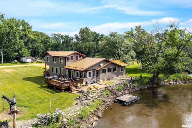 18599 317th St, Long Grove, IA 52756 - rear view of property featuring a lawn, a water view, a sunroom, and stairs