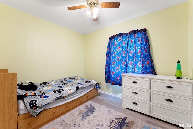 2506 Holly Dr, Bettendorf, IA 52722 - bedroom featuring light wood-style flooring and ceiling fan