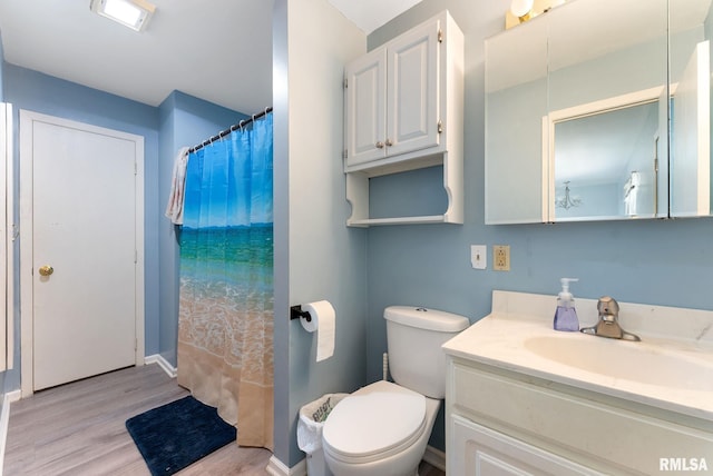2506 Holly Dr, Bettendorf, IA 52722 - full bathroom with wood finished floors, vanity, and curtained shower