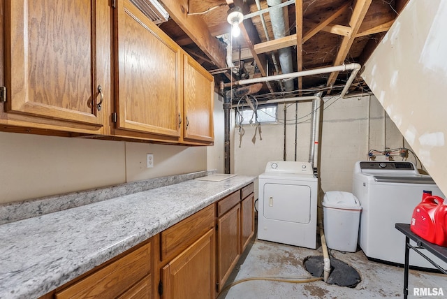 2506 Holly Dr, Bettendorf, IA 52722 - laundry area with washer and dryer and cabinet space