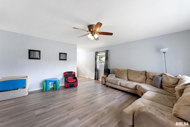 2506 Holly Dr, Bettendorf, IA 52722 - living room featuring ceiling fan and wood finished floors
